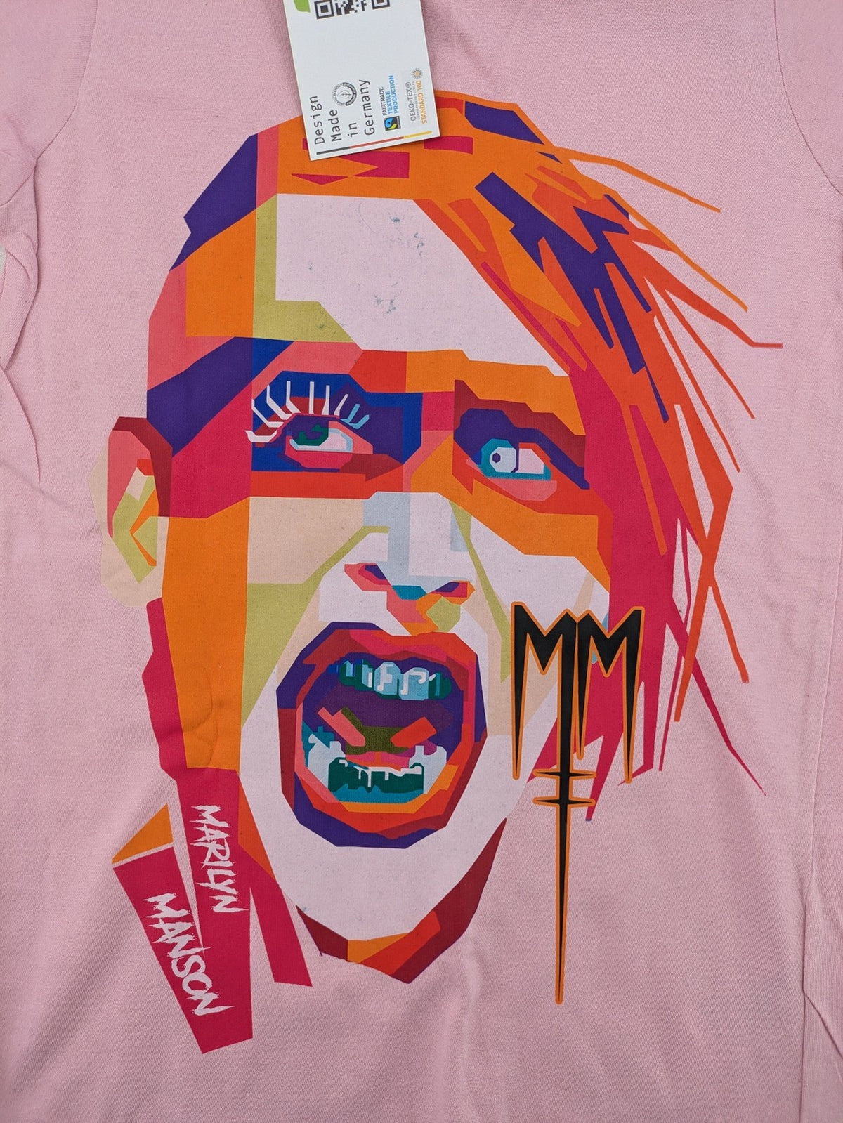 Marilyn Manson pink band t-shirt with colorful graphic portrait and "MM" logo.