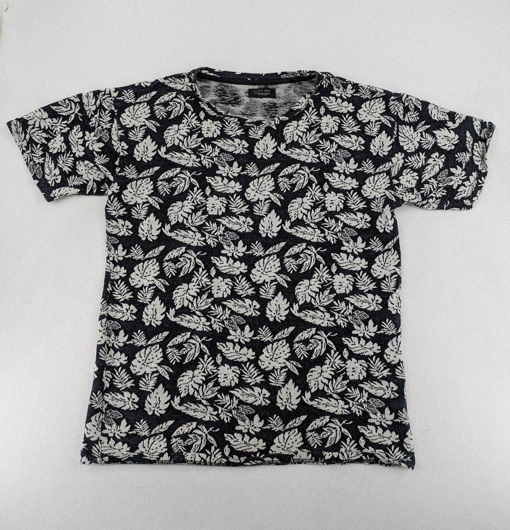Zara Man black and white t-shirt with allover leaf print and textured knit fabric.
