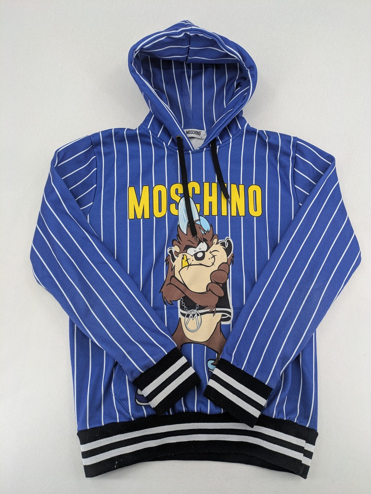 Moschino multi turtle neck jumper blue and white striped with Tasmanian Devil graphic.