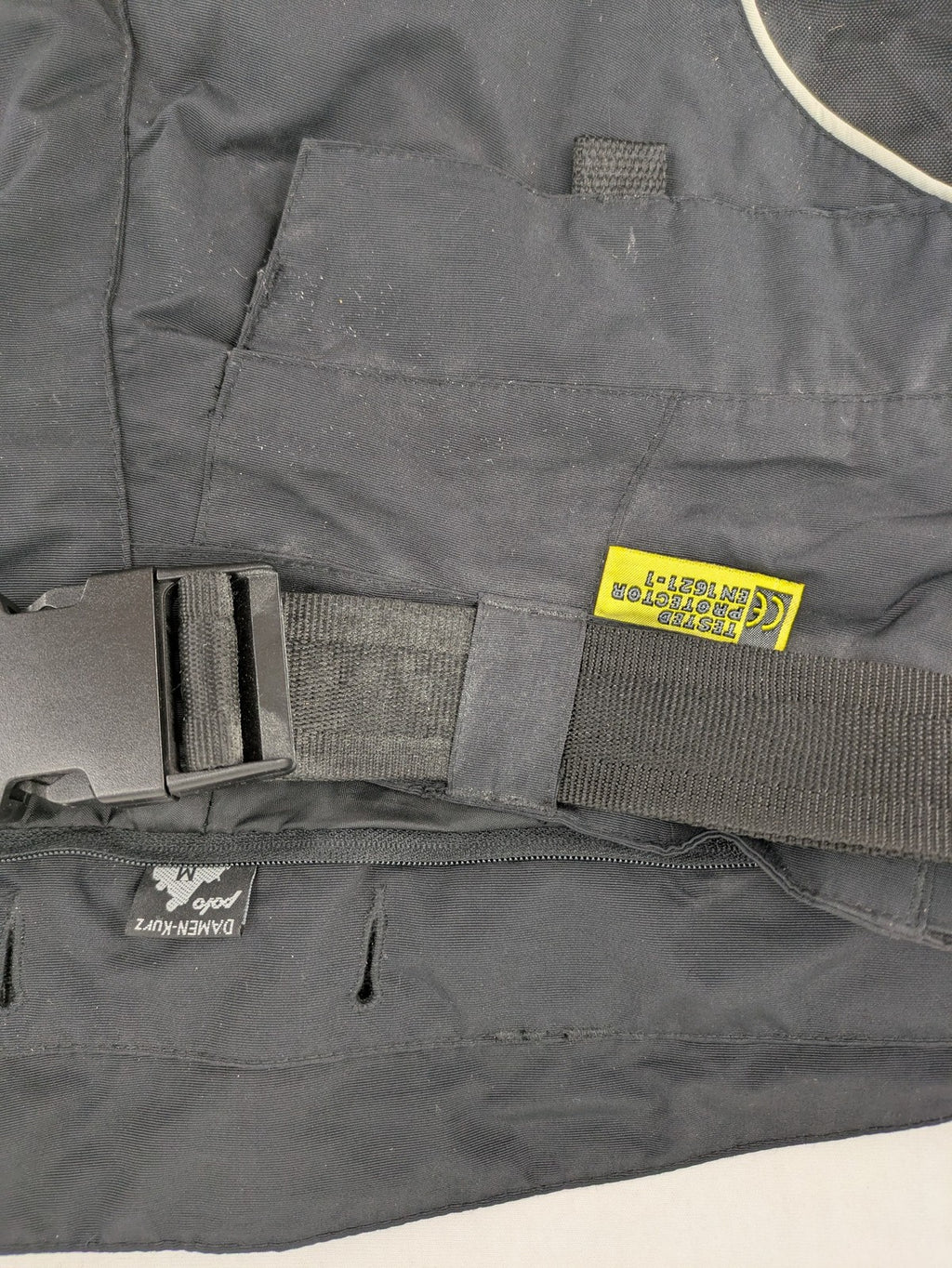 Polo black chaps with grey and white accents, featuring protective knee pads and adjustable belt.