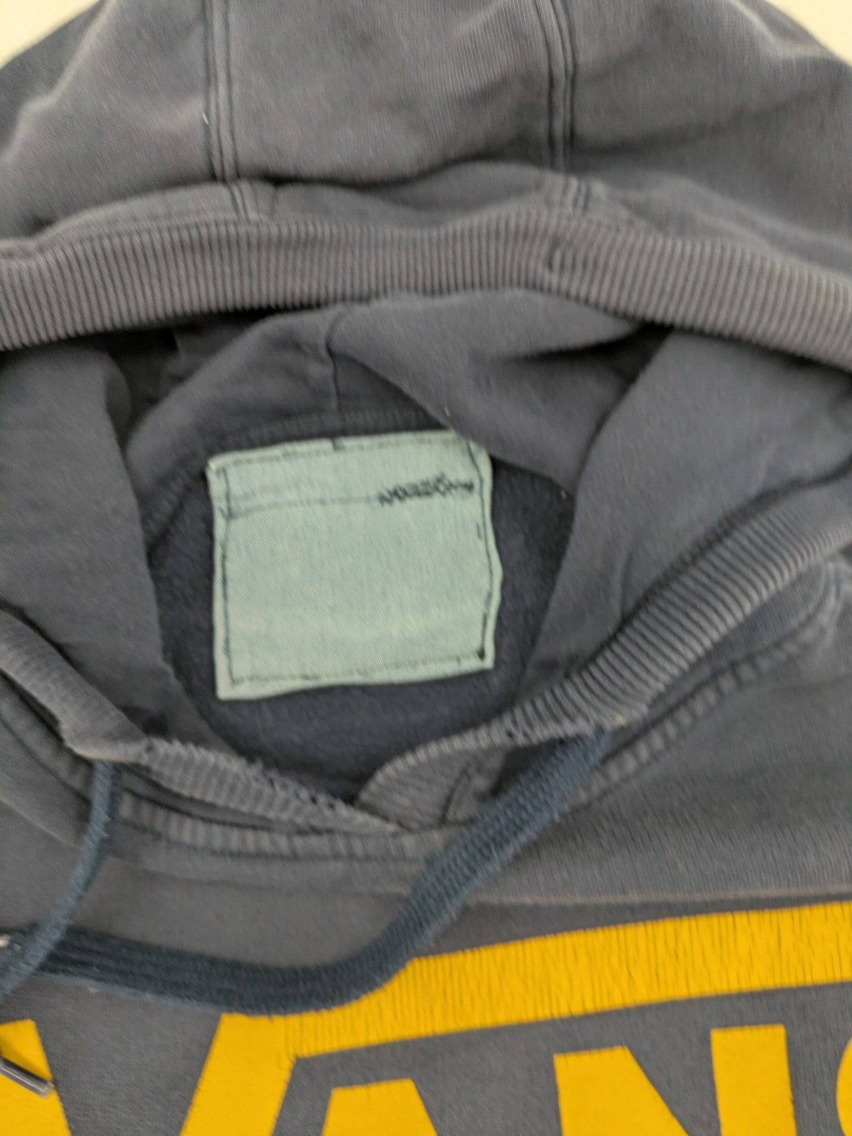 Vans zip-through hoodie navy blue with large yellow logo and kangaroo pocket.