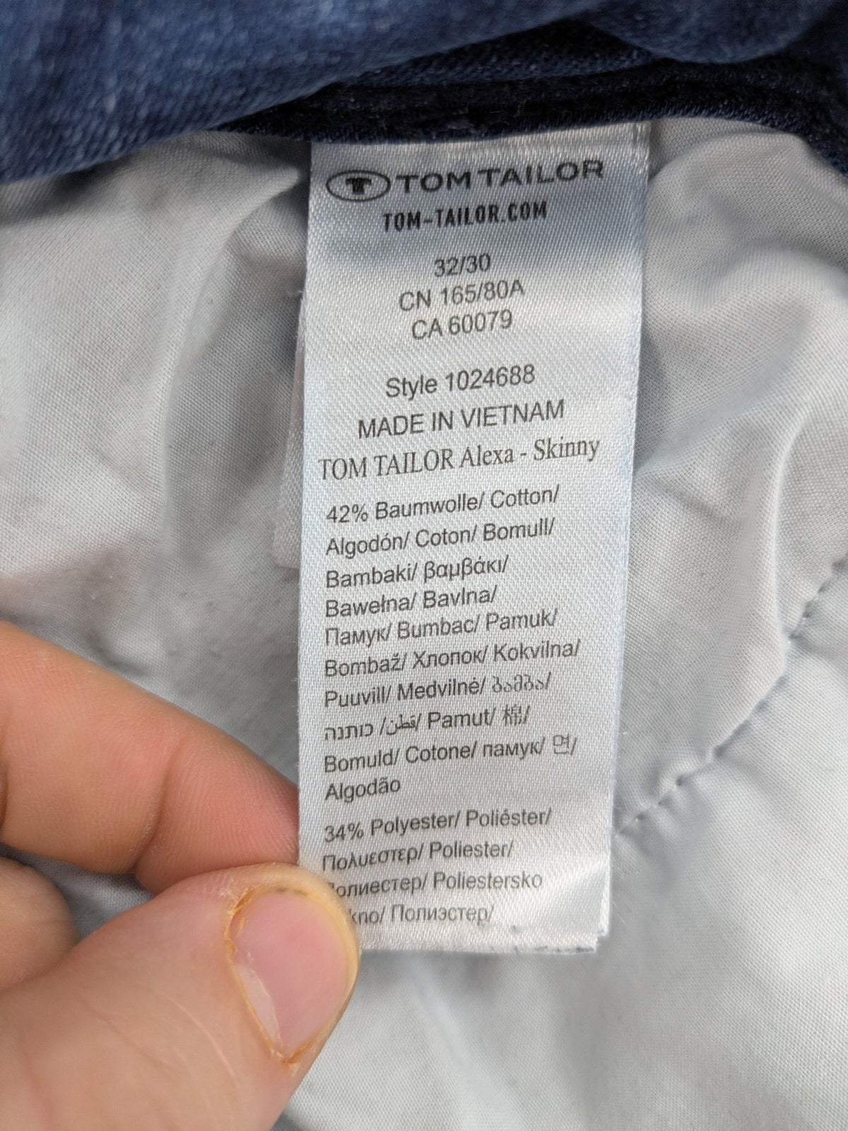 Tom Tailor blue skinny jeans with classic 5-pocket design and double button closure.