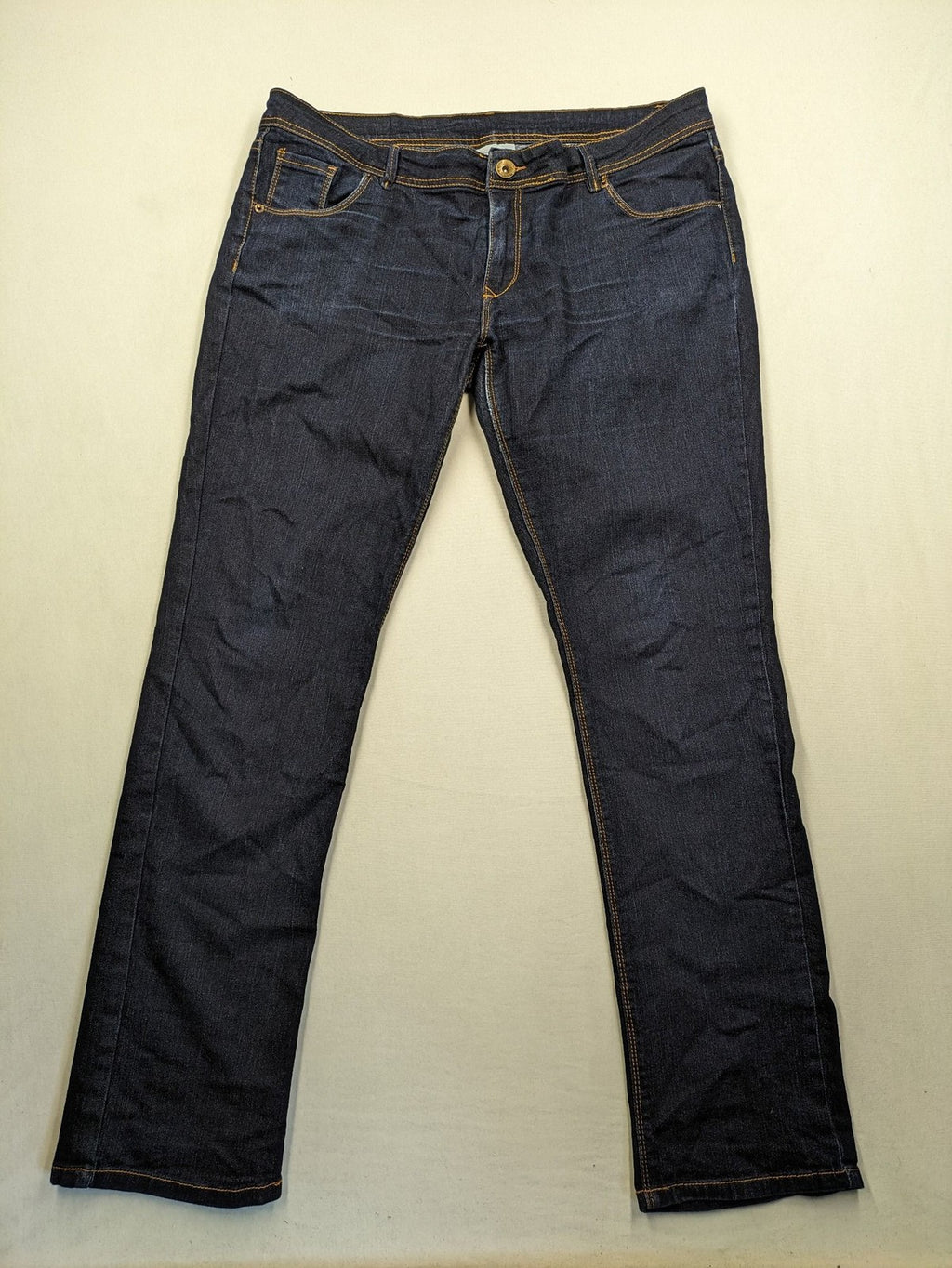 Okay blue straight jeans dark wash 5-pocket style with stretch material for comfort.