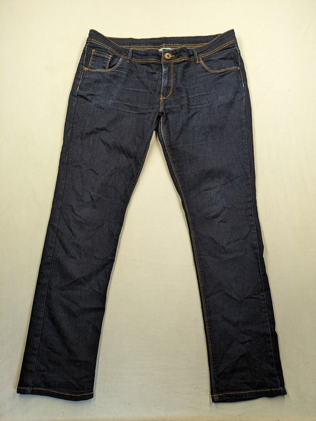 Okay blue straight jeans dark wash 5-pocket style with stretch material for comfort.