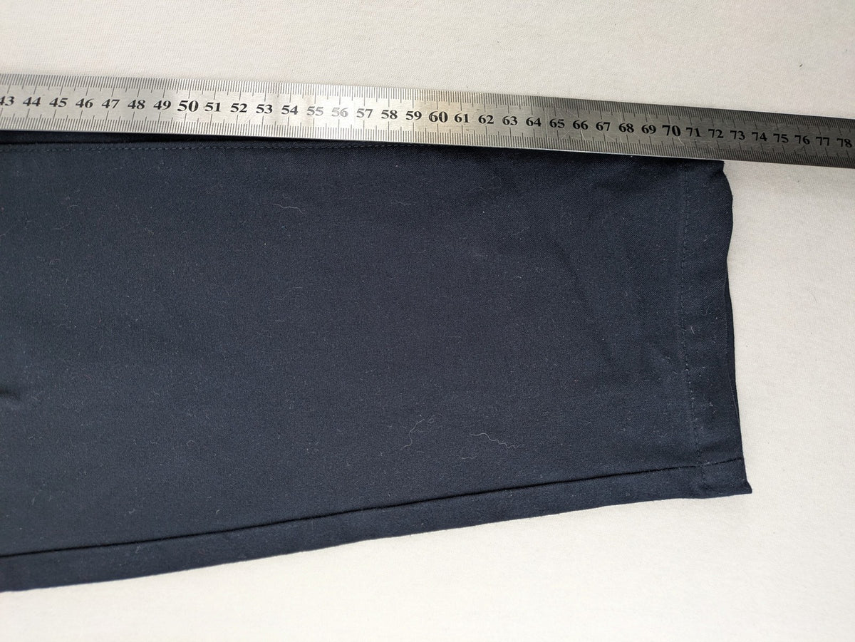 Zara navy chinos flat front design with stretch fabric for comfort and versatility.