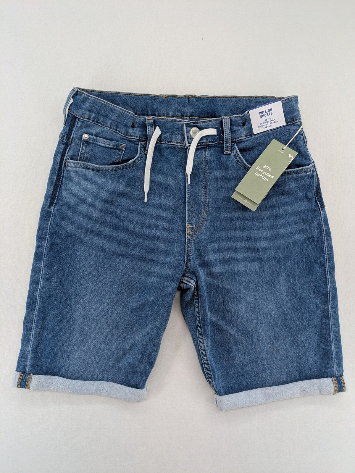 H&M blue denim shorts with adjustable drawstring, rolled hem, classic 5-pocket design.