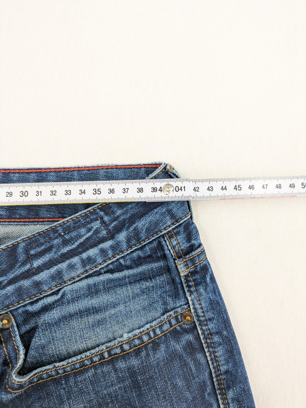W32 blue straight jeans with classic 5-pocket design and dark wash denim.