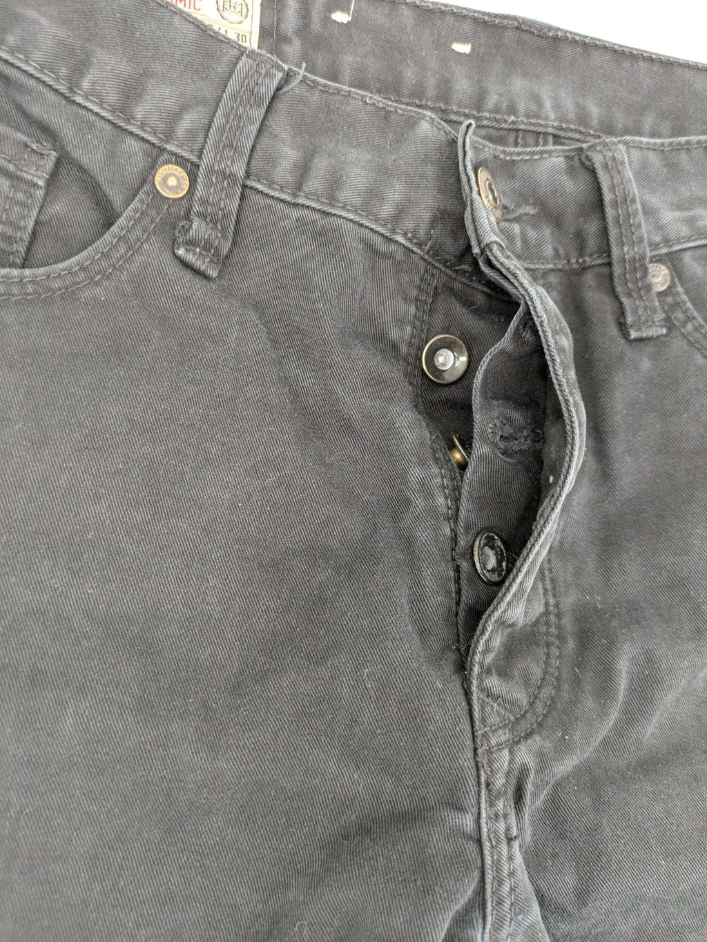 Ckh grey straight fit jeans with button fly and faded wash details.
