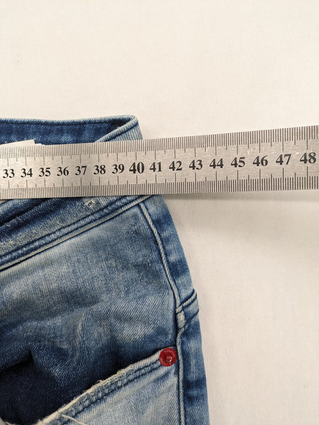 W32 blue straight jeans distressed details tapered fit button fly design