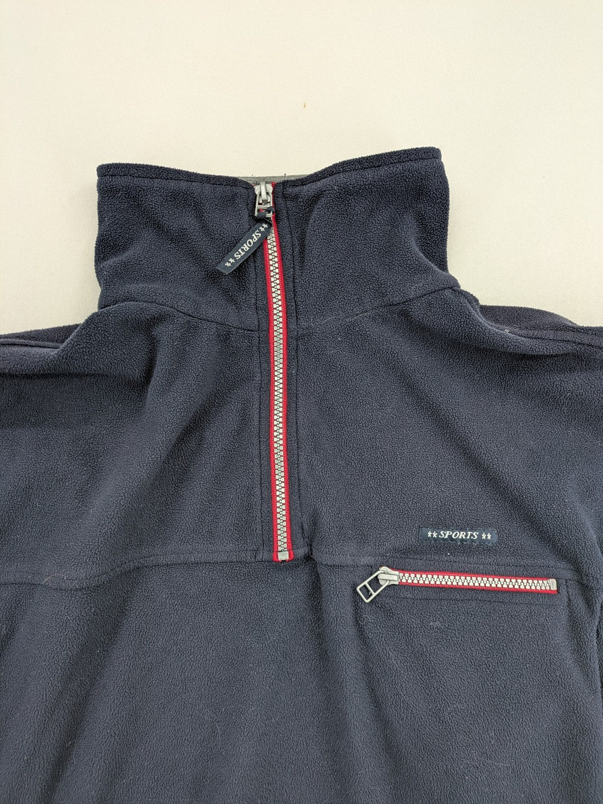 Sport Division turtle neck jumper dark blue fleece with quarter zip and chest pocket.