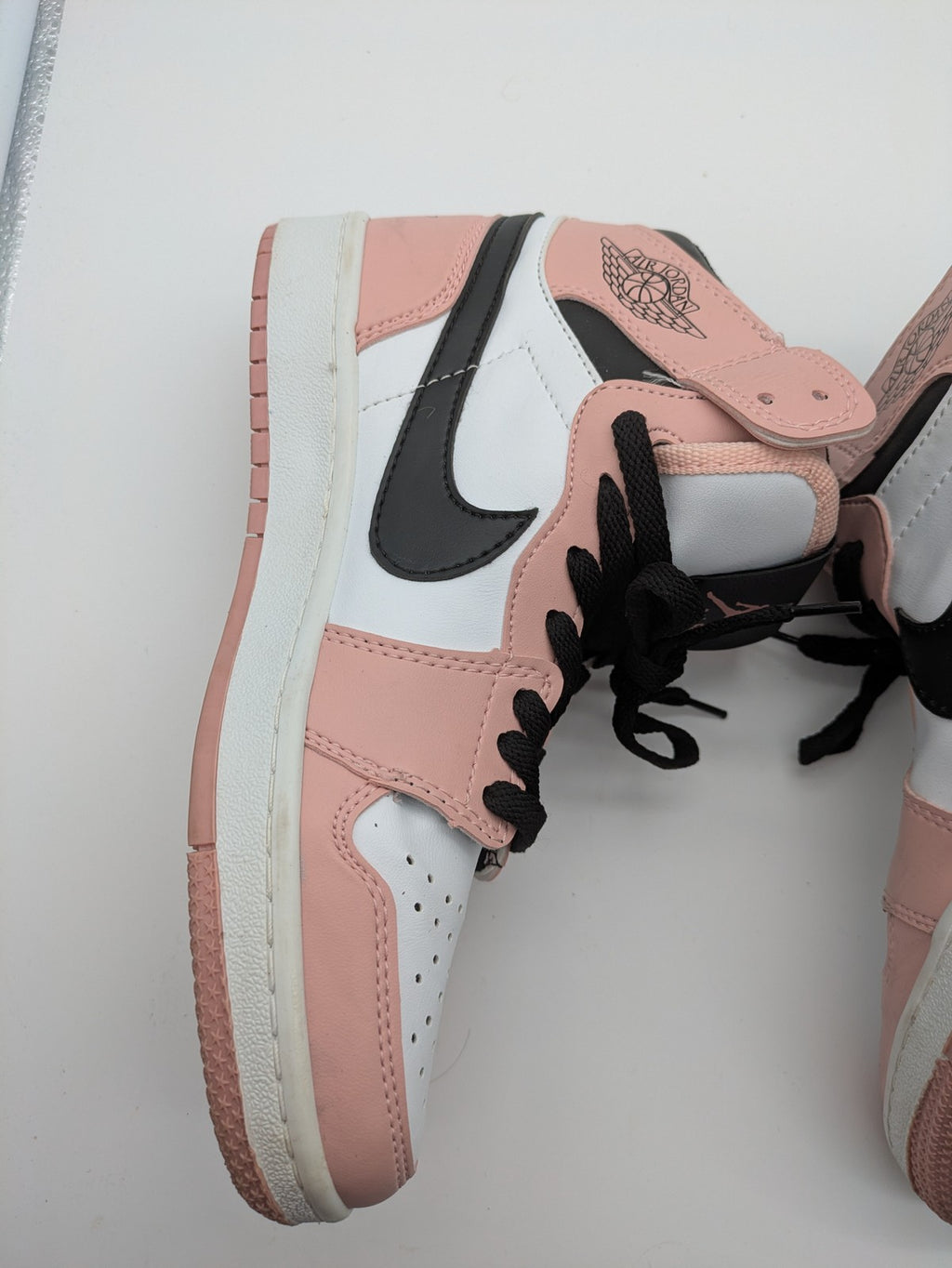 Nike Air Jordan high-top sneakers multi with Wings logo, Jumpman detail, and perforated toe.