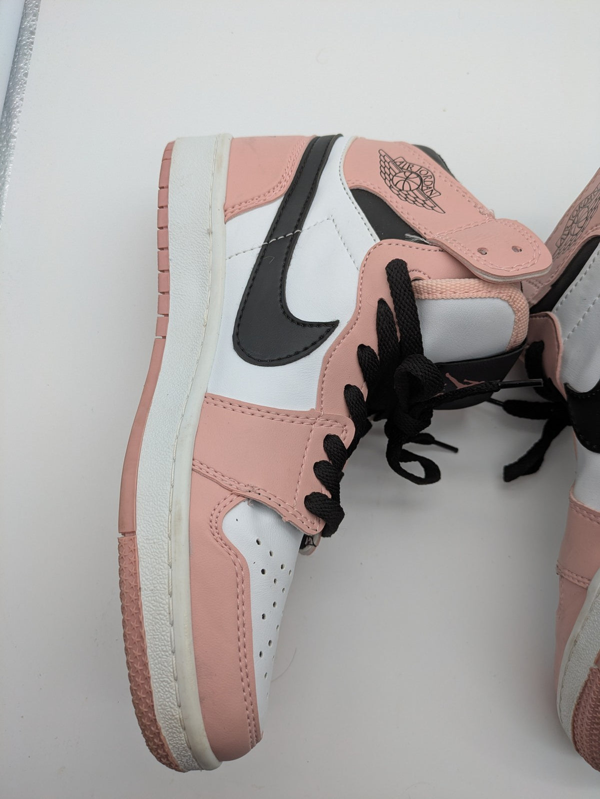 Nike Air Jordan high-top sneakers multi with Wings logo, Jumpman detail, and perforated toe.