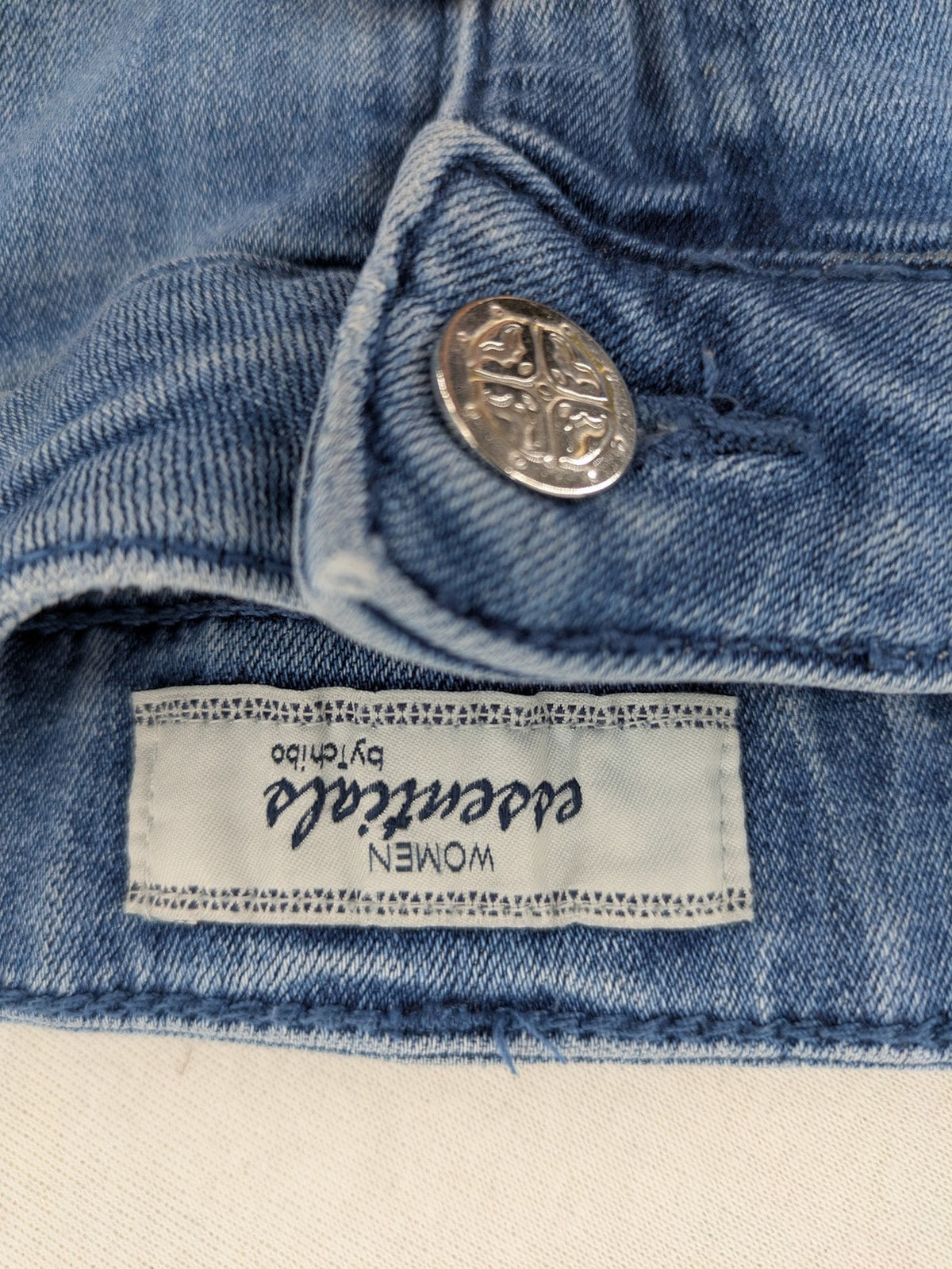 Tchibo blue A-line denim skirt classic five-pocket design with zipper and button closure.