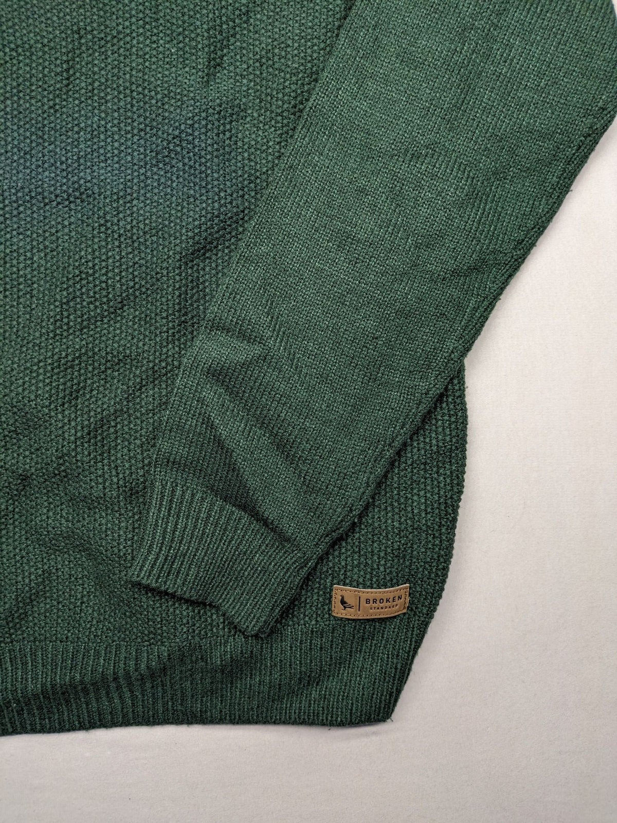 Broken Standard turtle neck jumper green waffle knit texture with classic round neckline.