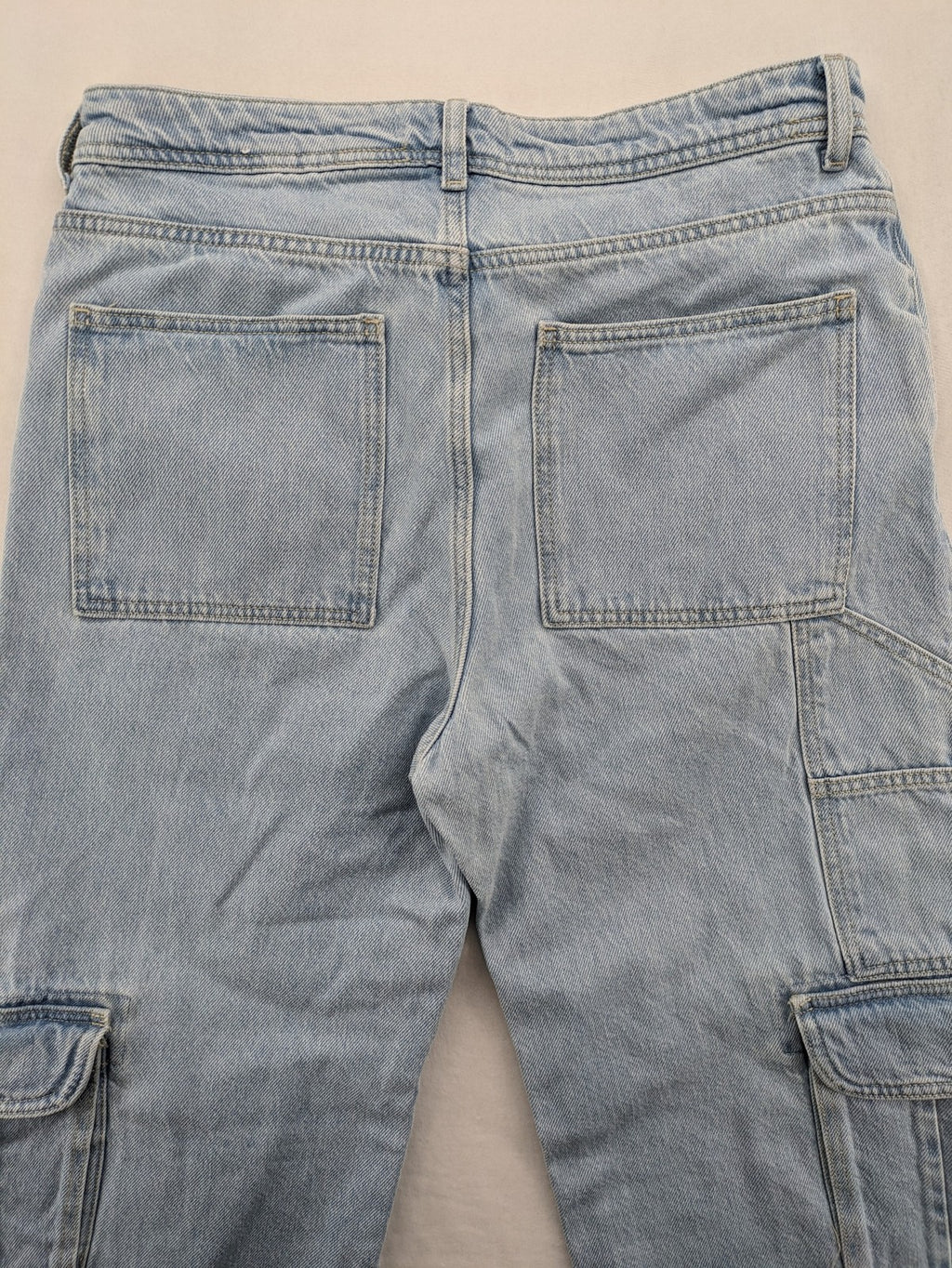 MNG blue straight jeans with cargo pockets and raw hem, high waist denim.