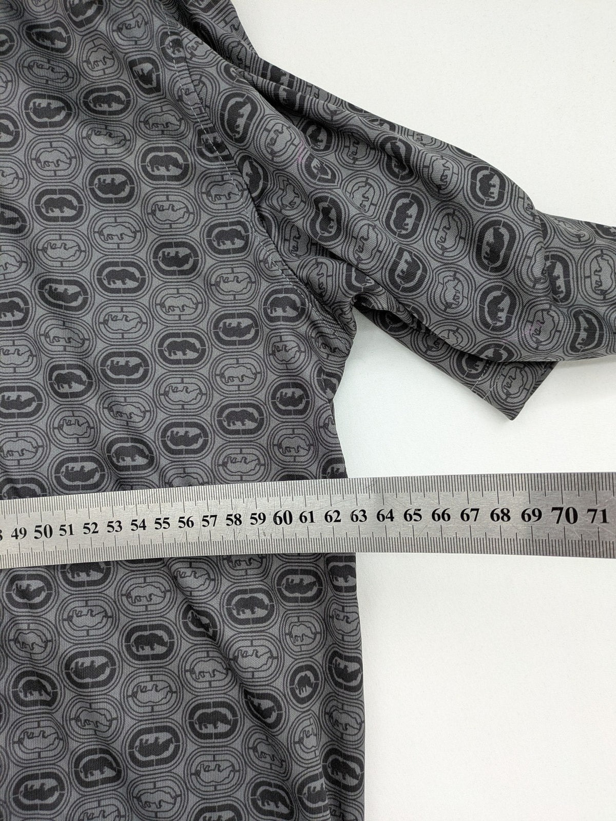Ecko Unltd. grey soccer uniform V-neck with all-over logo print and embroidered FC patch.