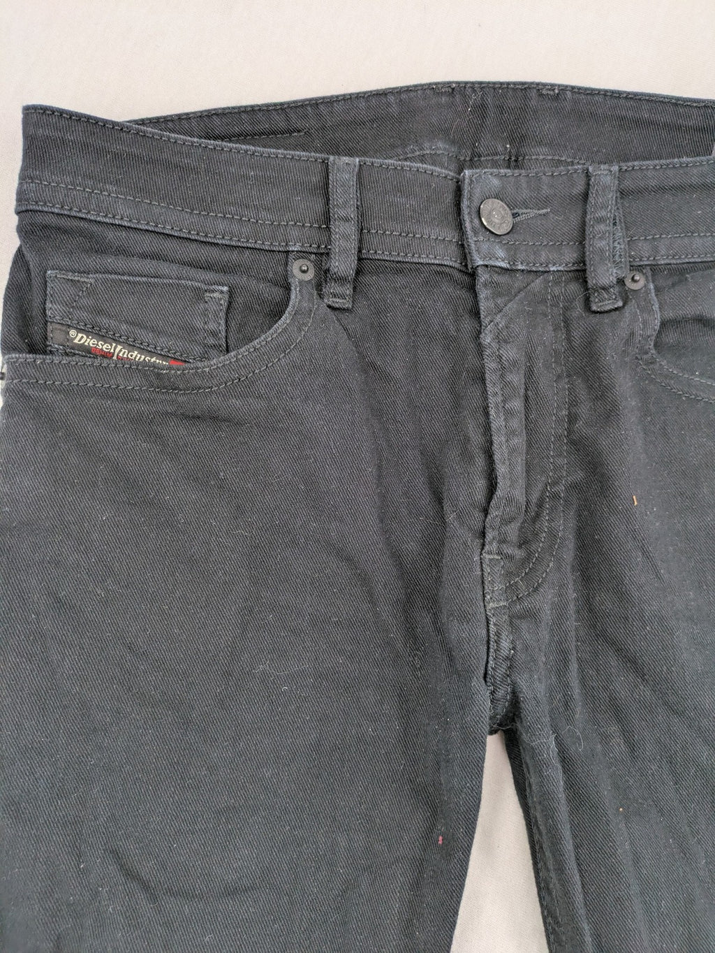 Diesel black Thommer Slim jeans with classic 5-pocket design and stretch material.