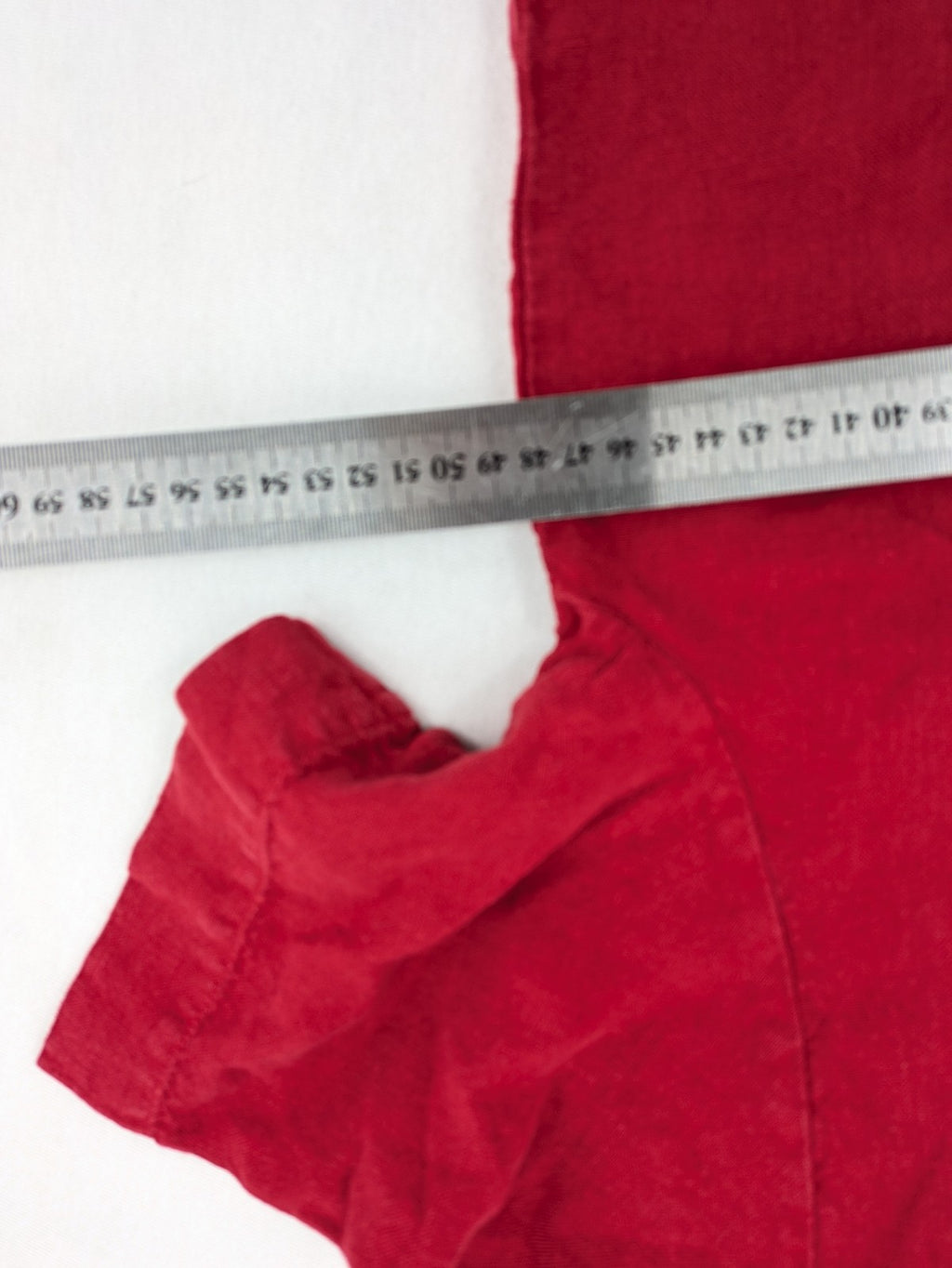Deerberg red short-sleeve linen blouse with collar, button placket, and side slits.