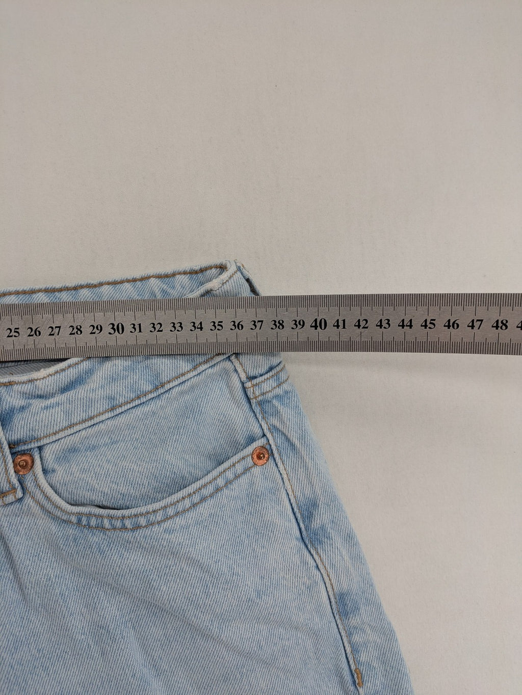 MNG blue high waist mom jeans with raw hem and five-pocket style.