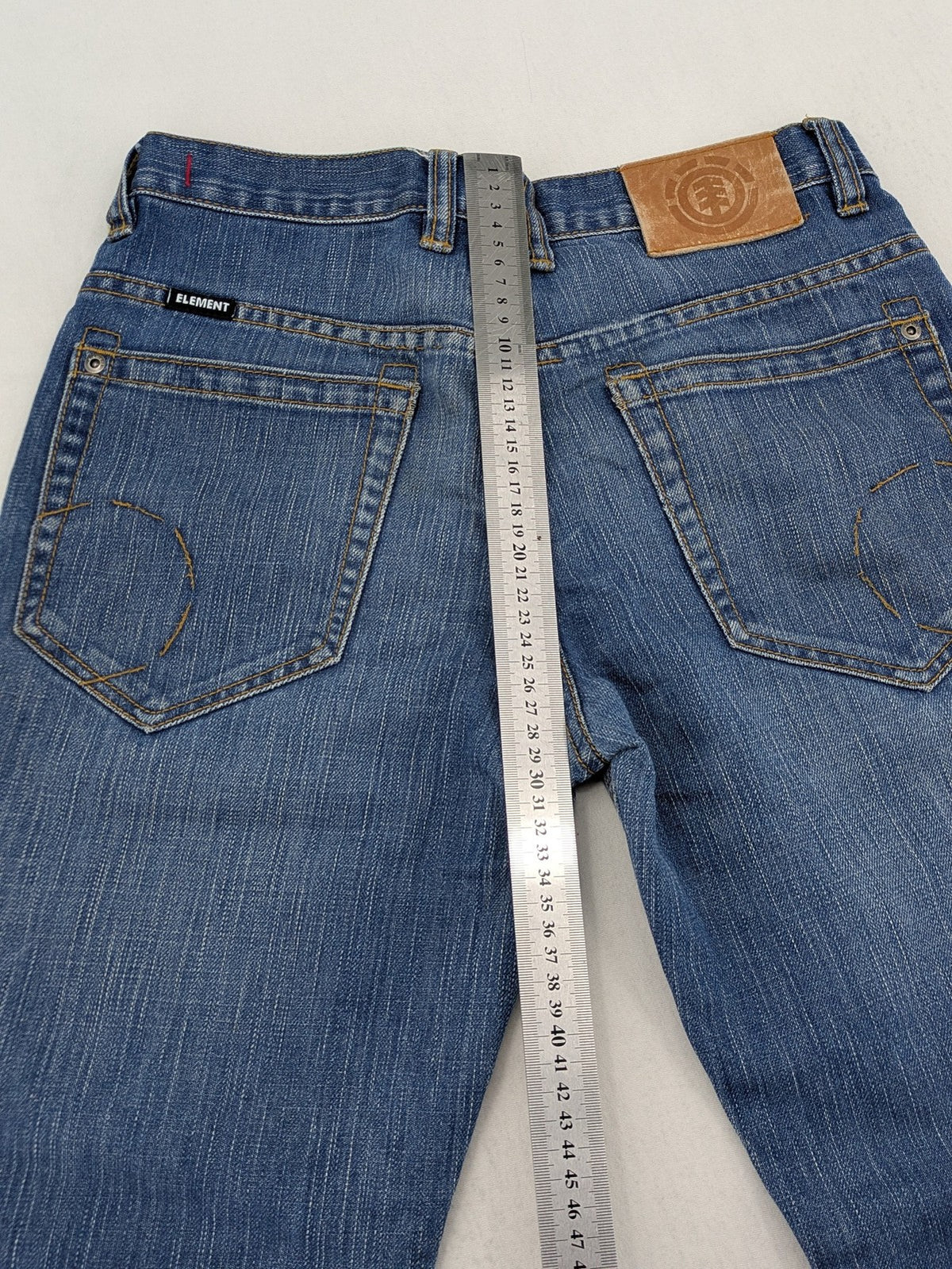 Element blue straight jeans with classic button fly and 5-pocket design.
