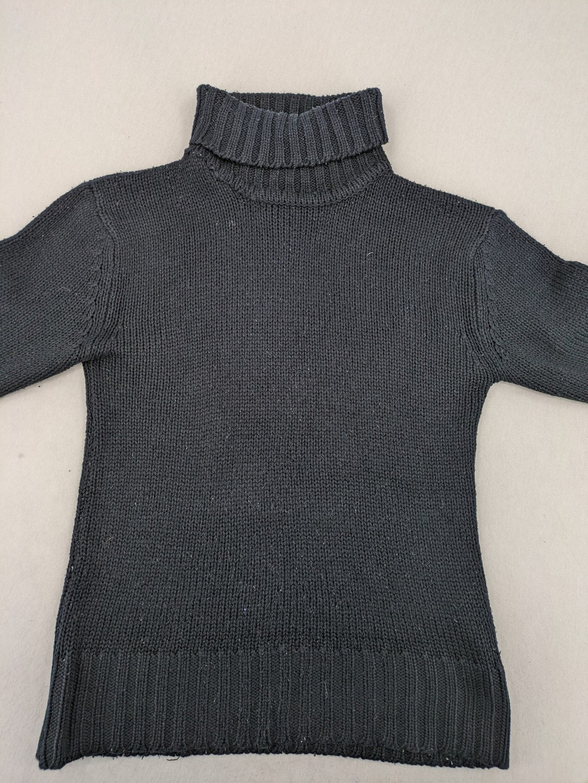 Fishbone grey turtle neck jumper with ribbed cuffs and soft acrylic knit material.