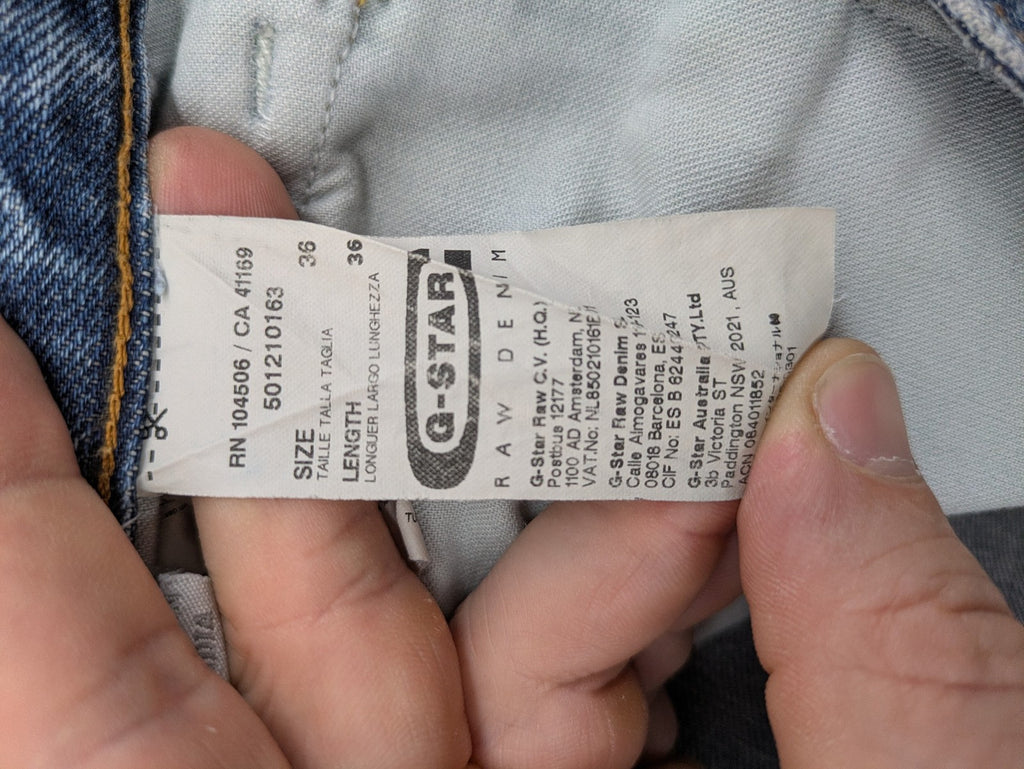 G-Star Raw blue straight jeans with distressed details and classic button fly.