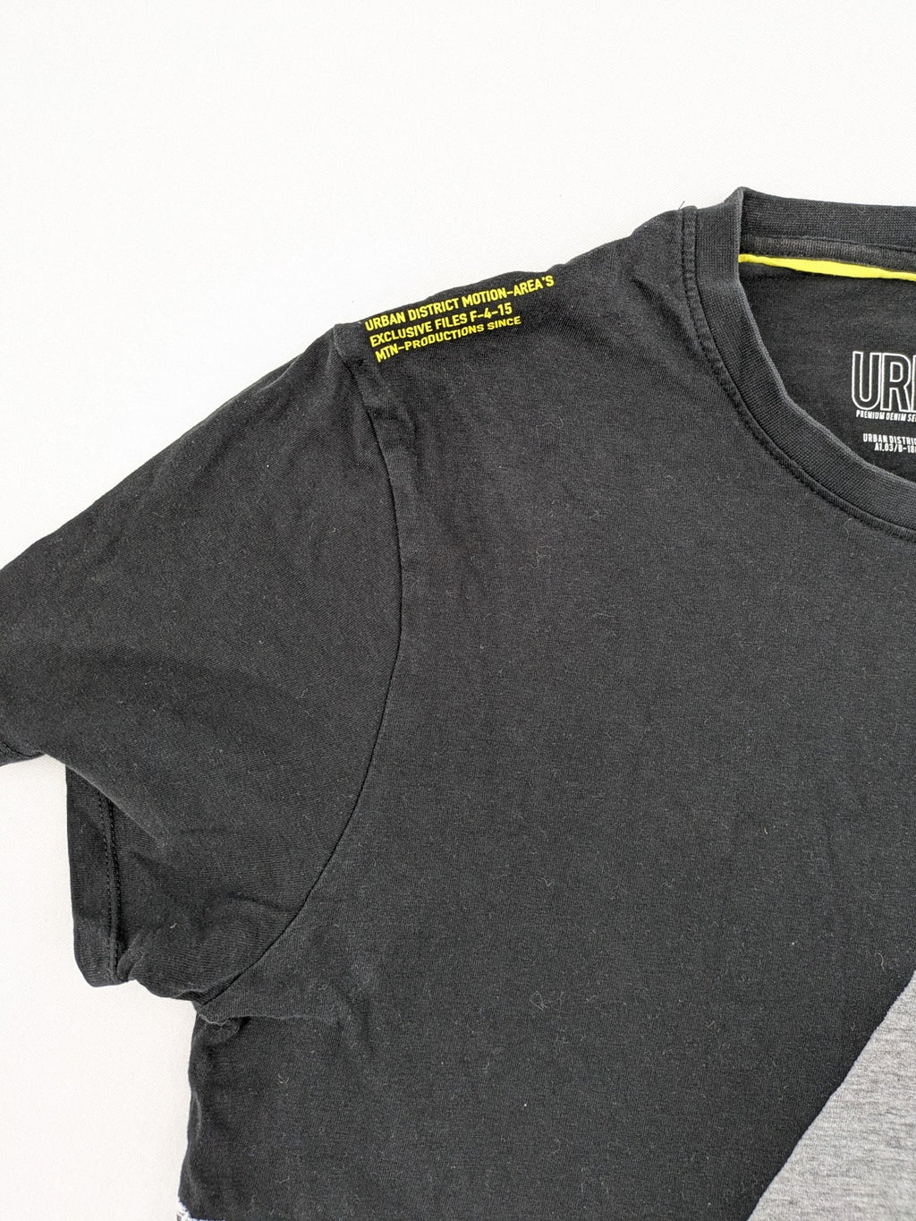 Angelo Litrico black and grey colorblock t-shirt with logo accents and soft cotton blend.