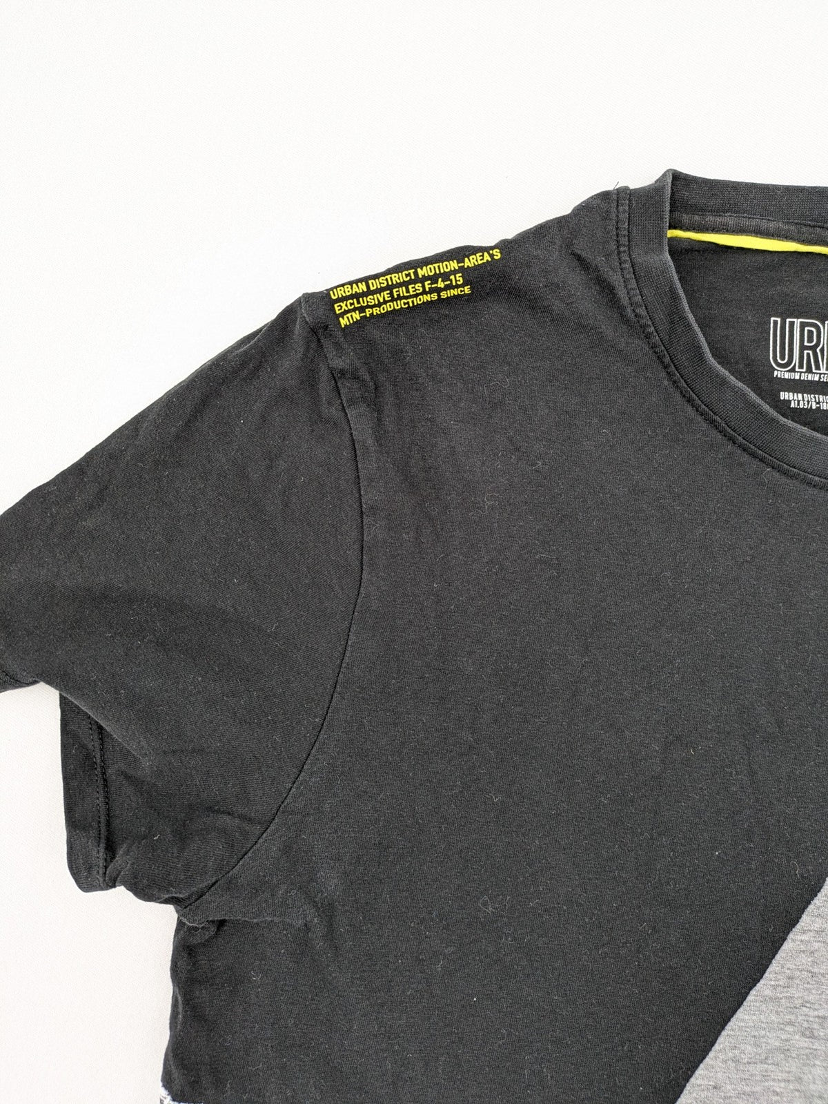 Angelo Litrico black and grey colorblock t-shirt with logo accents and soft cotton blend.