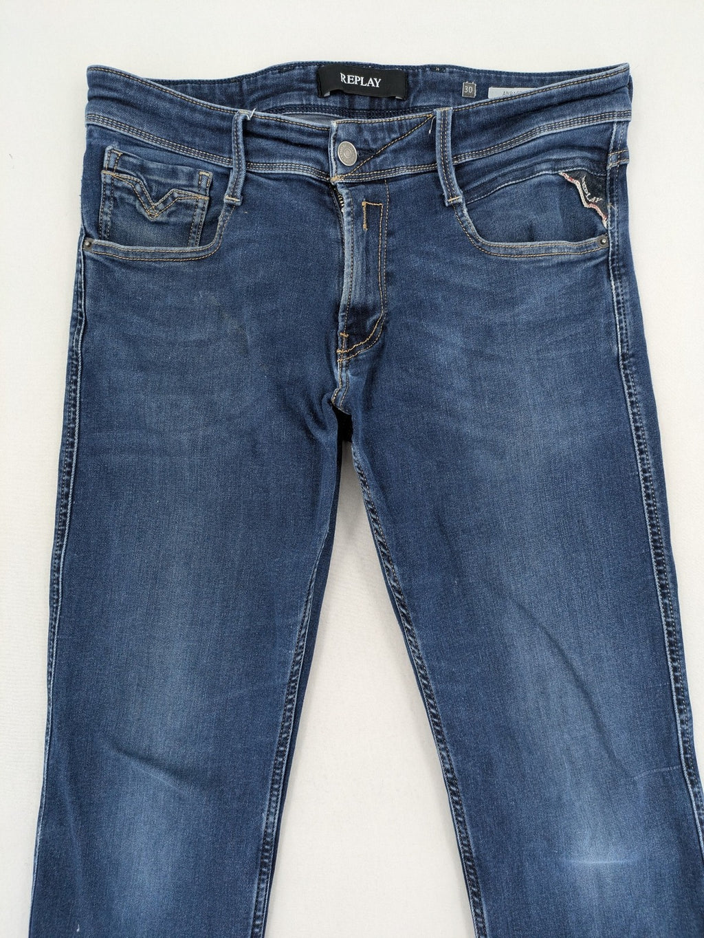 Replay slim fit jeans blue with subtle fading and stretch denim material.