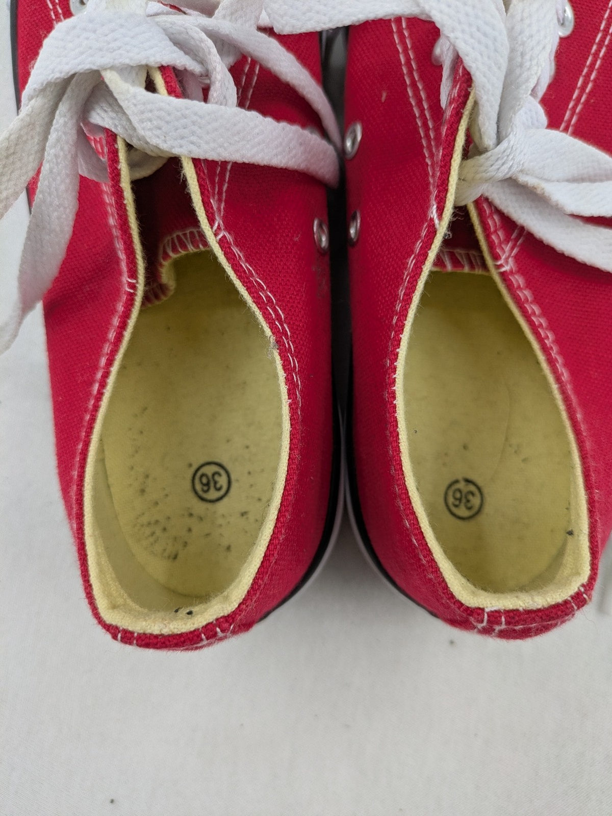 Sneaker low-top canvas sneakers red upper with white laces and rubber sole