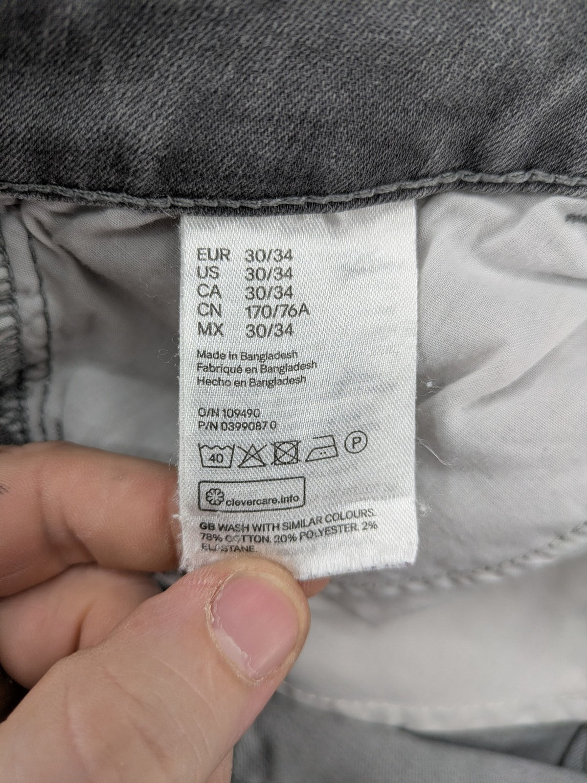 H&M grey super skinny jeans with distressed knee details and low waist fit.