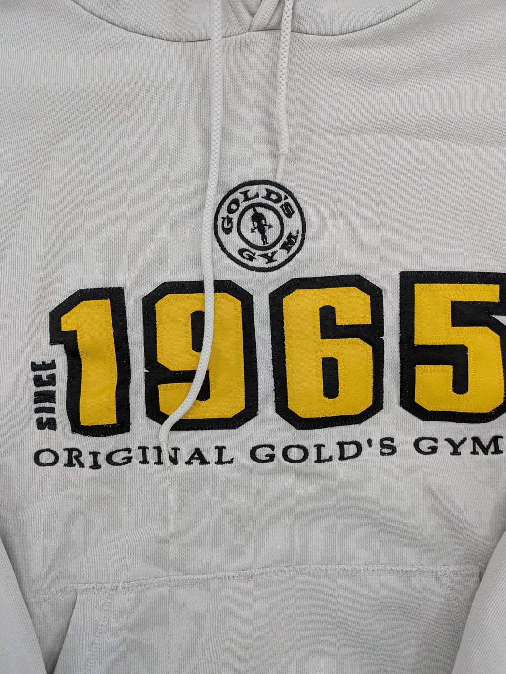 Gold's Gym grey hoodie with embroidered "Since 1965" logo and kangaroo pocket.