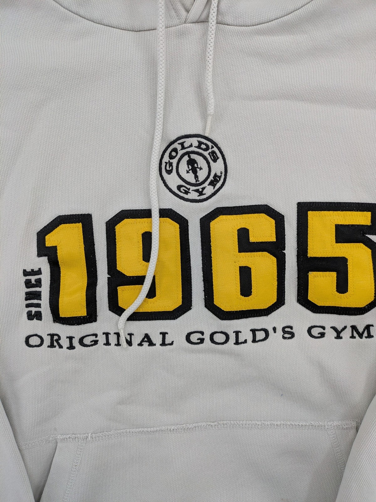 Gold's Gym grey hoodie with embroidered "Since 1965" logo and kangaroo pocket.