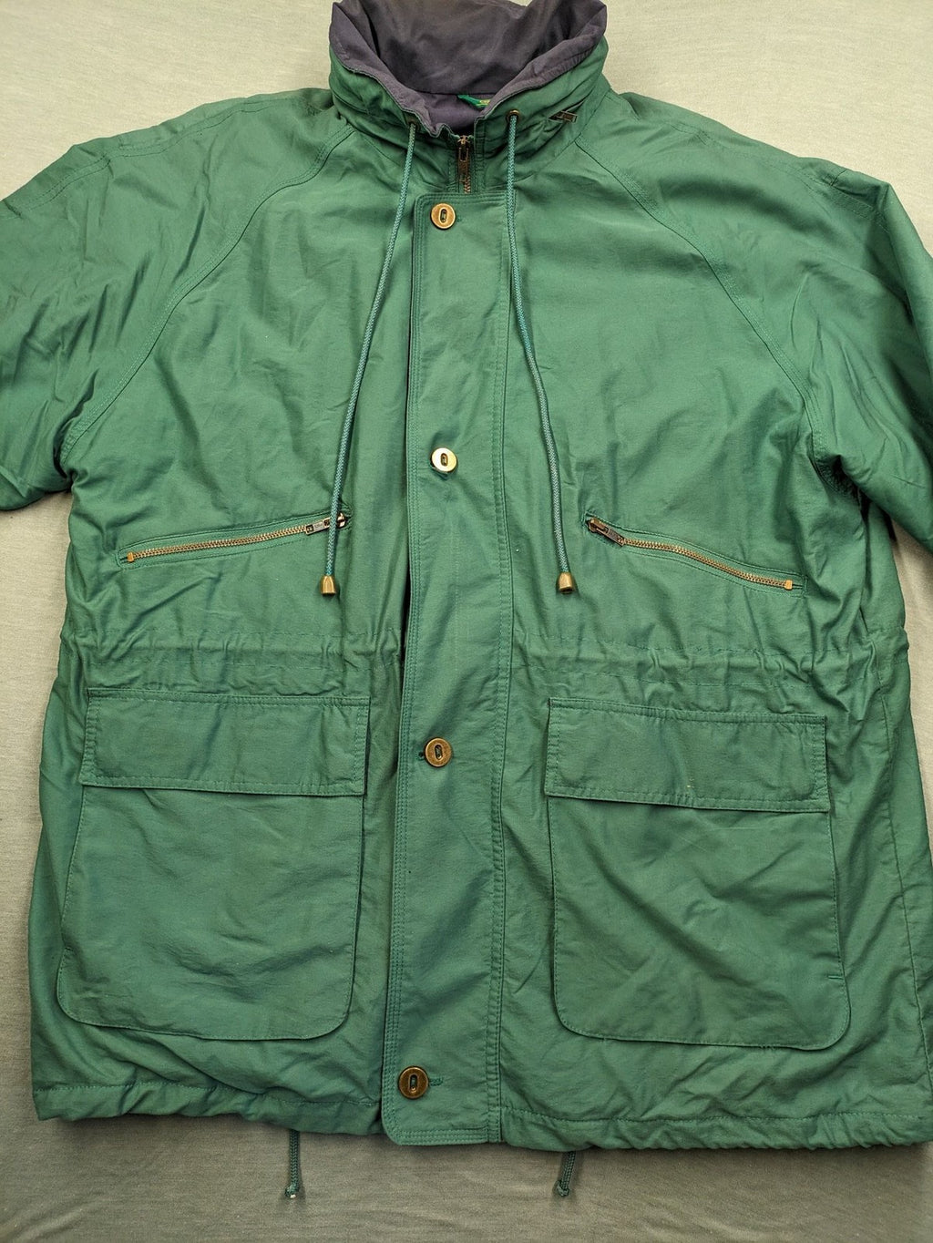Canda green parka coat with dark lining, multiple pockets, and Micro Membrane technology.