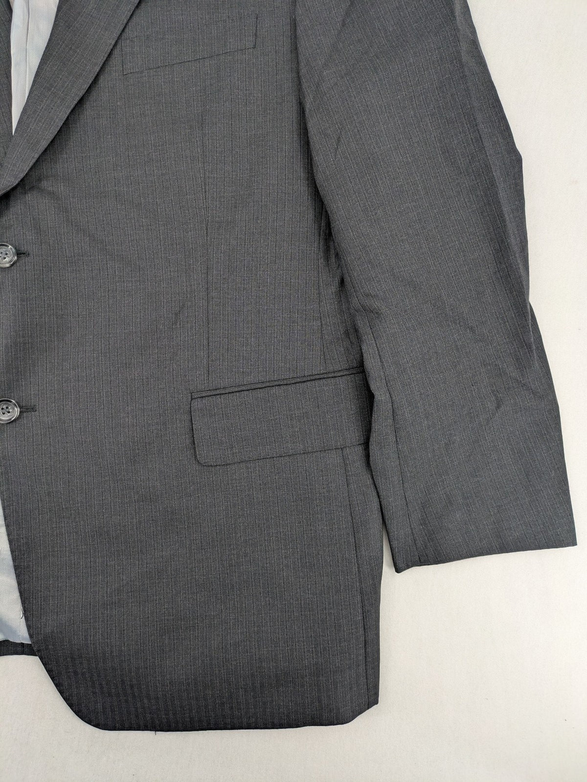 Desch grey blazer with dark grey pinstripe pattern, satin lining, and tailored design.