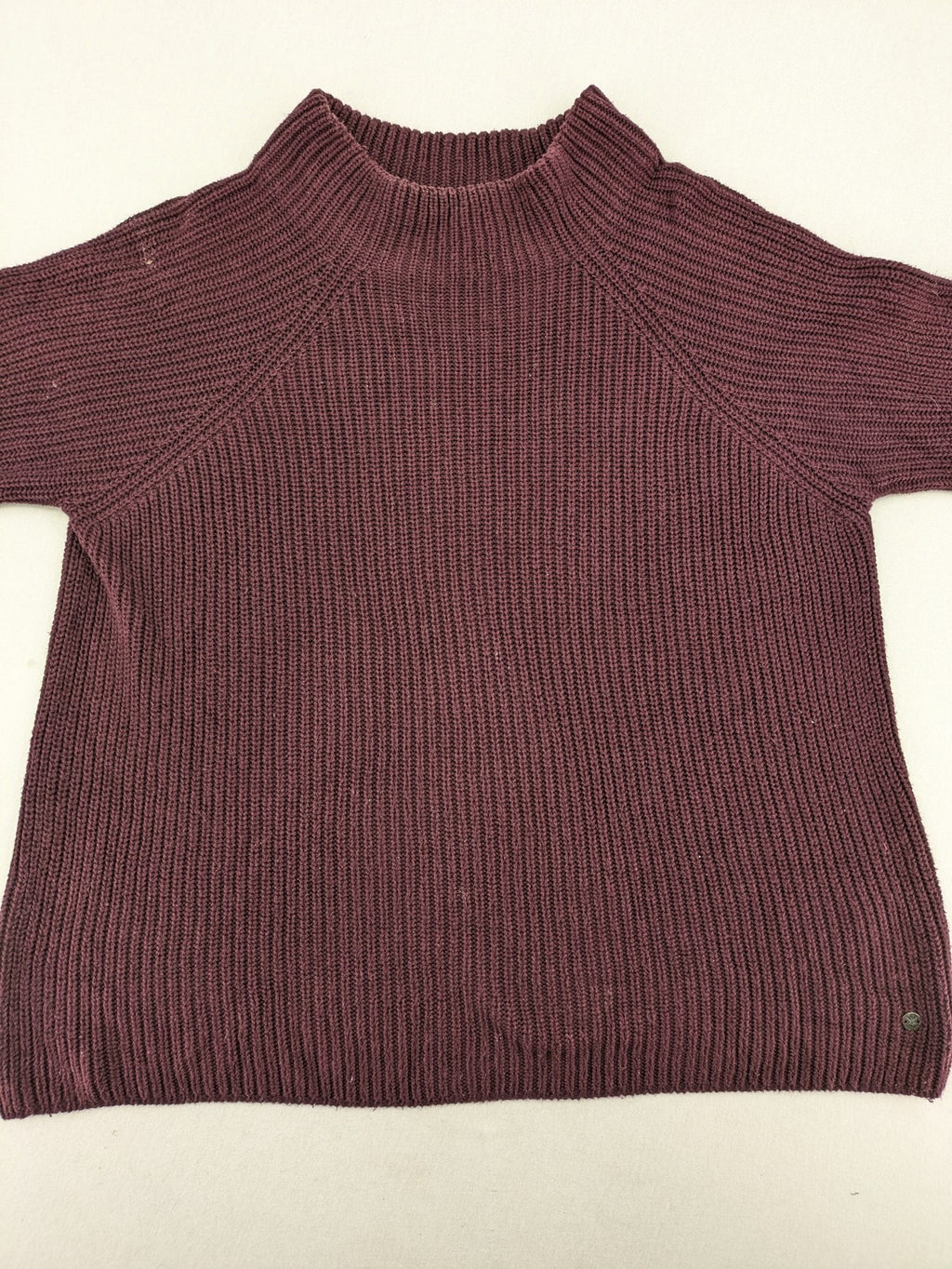 Monari burgundy knit jumper with standing collar, ribbed texture, and raglan sleeves.
