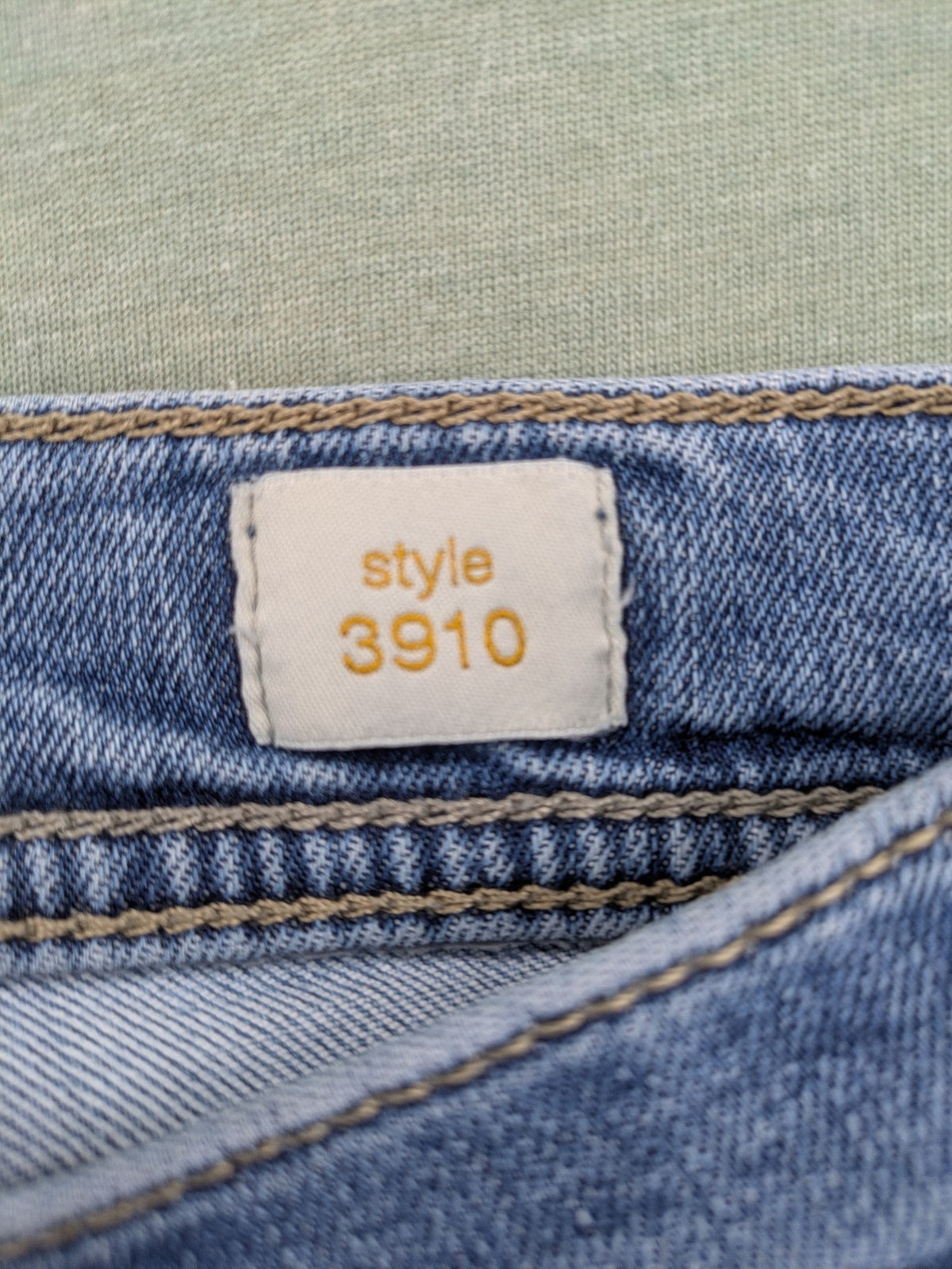 Bugatti blue straight jeans with classic 5-pocket design and light wash denim.