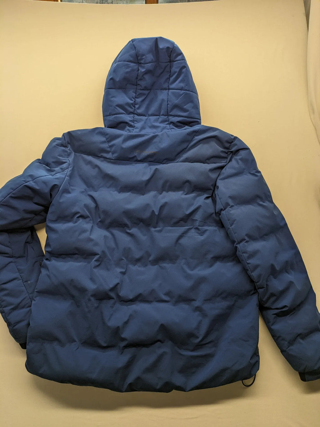 C&A blue winter jacket with hood, zip closure, and multiple pockets, used condition.