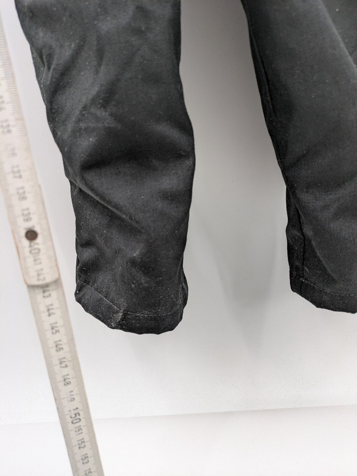 Hein Gericke black chaps with adjustable suspenders, made from durable Cordura and Kevlar.