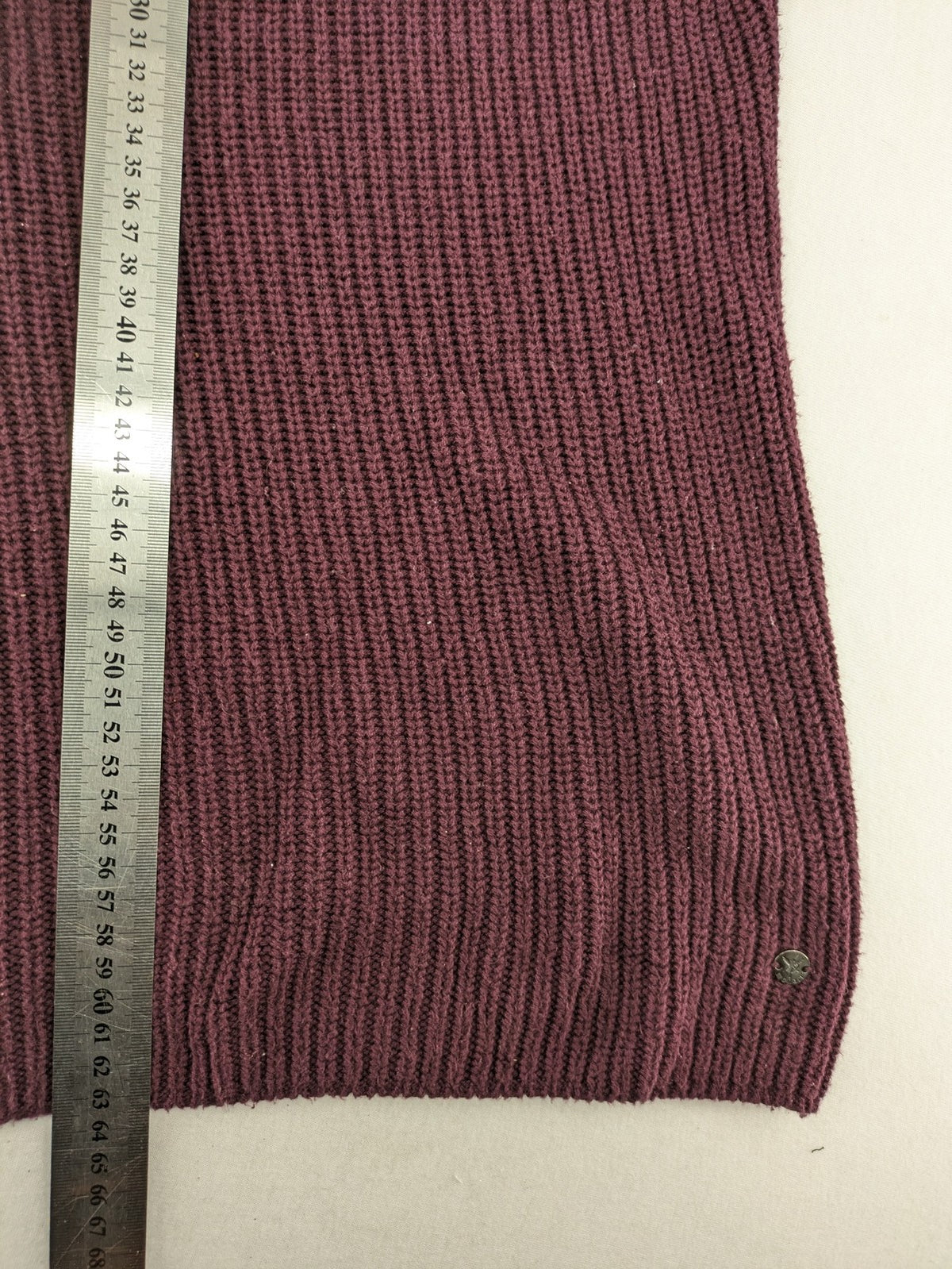 Monari burgundy knit jumper with standing collar, ribbed texture, and raglan sleeves.