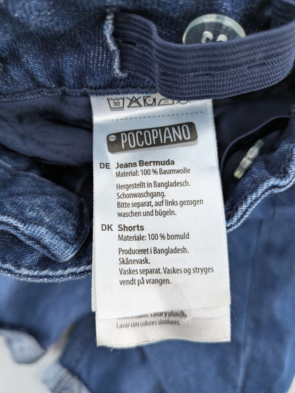 Pocopiano blue denim shorts with rolled cuffs and elastic waistband for comfort.