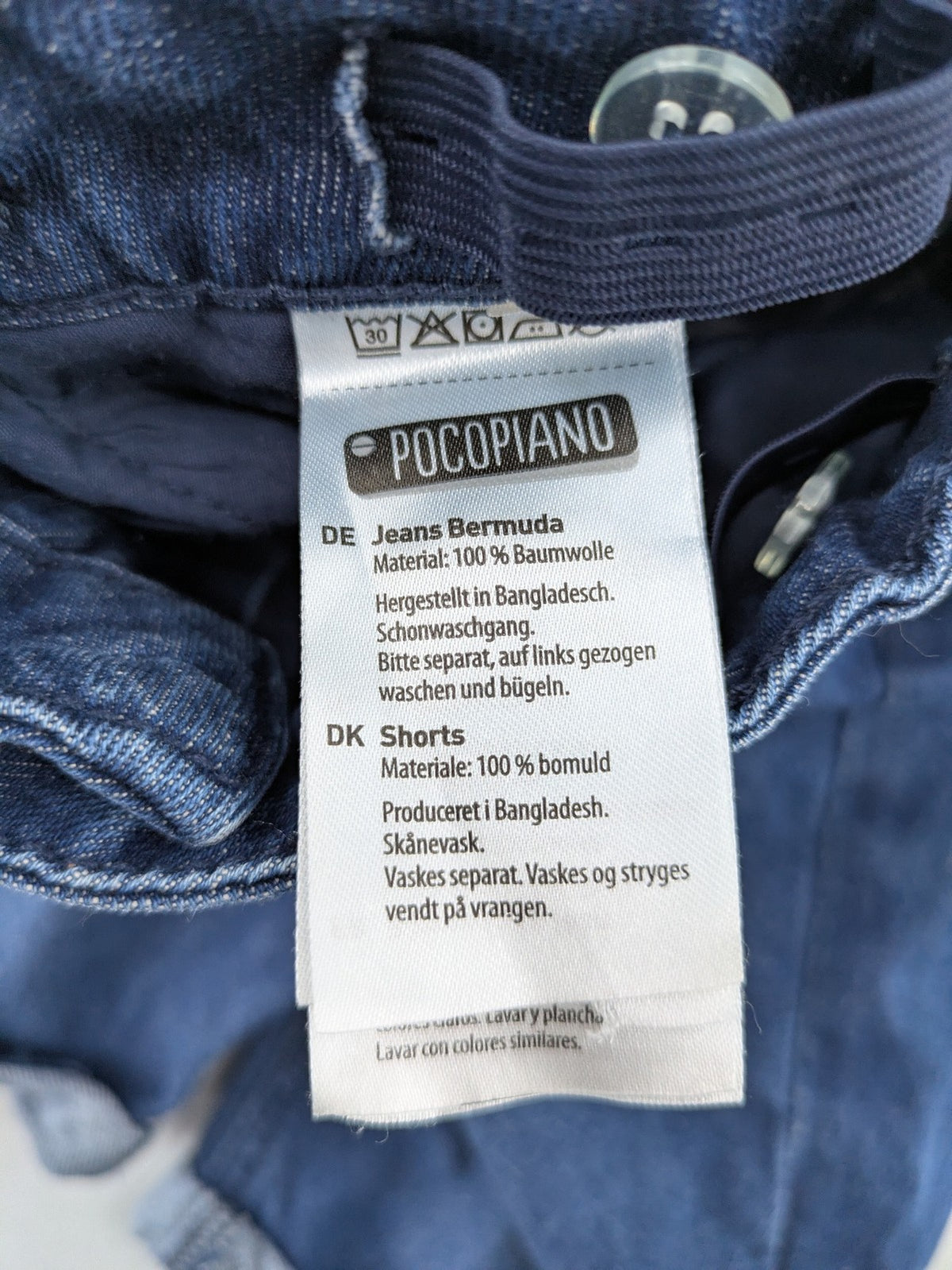 Pocopiano blue denim shorts with rolled cuffs and elastic waistband for comfort.