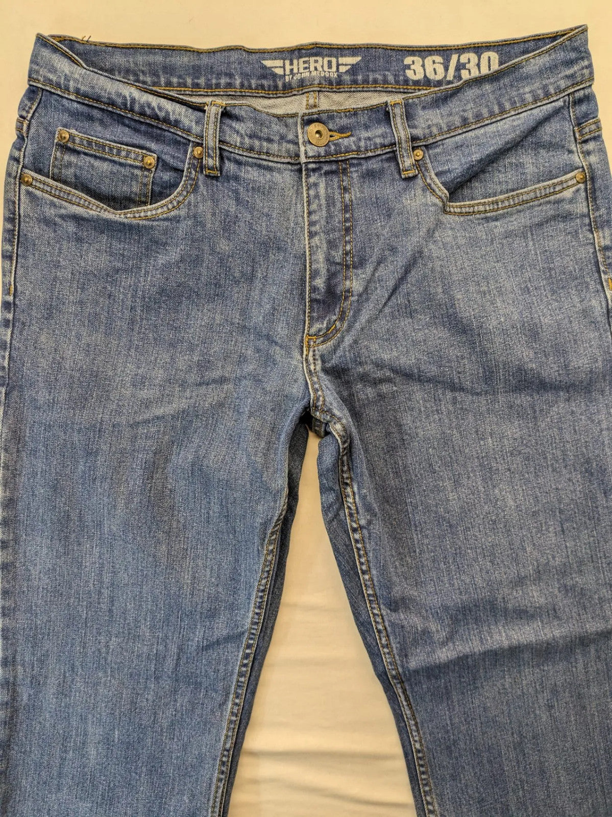 Hero By John Meddox blue straight jeans with five-pocket design and zip fly.