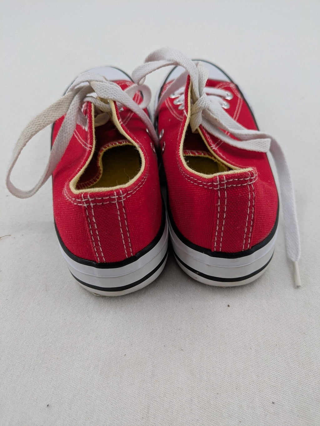 Sneaker low-top canvas sneakers red upper with white laces and rubber sole