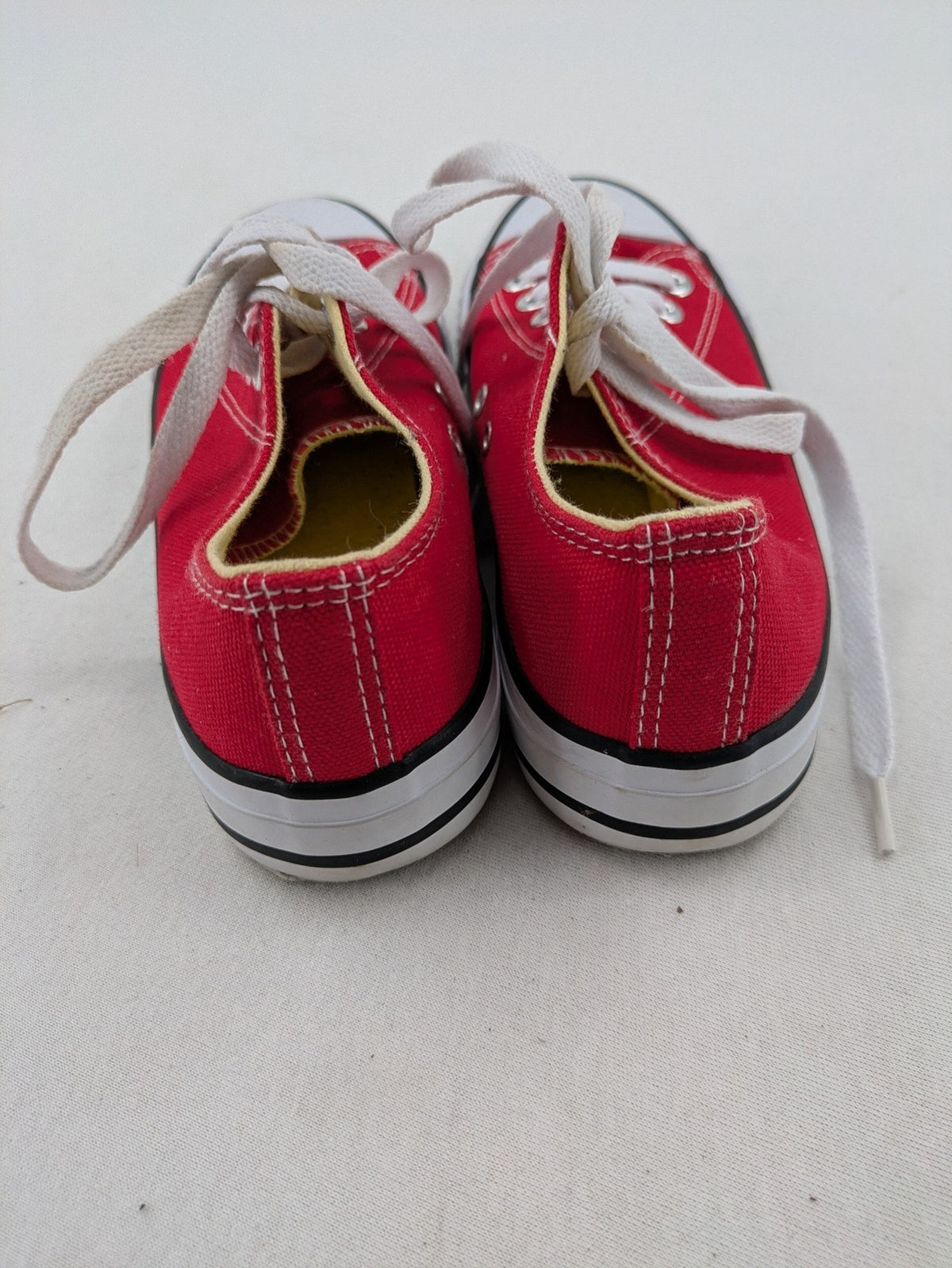 Sneaker low-top canvas sneakers red upper with white laces and rubber sole