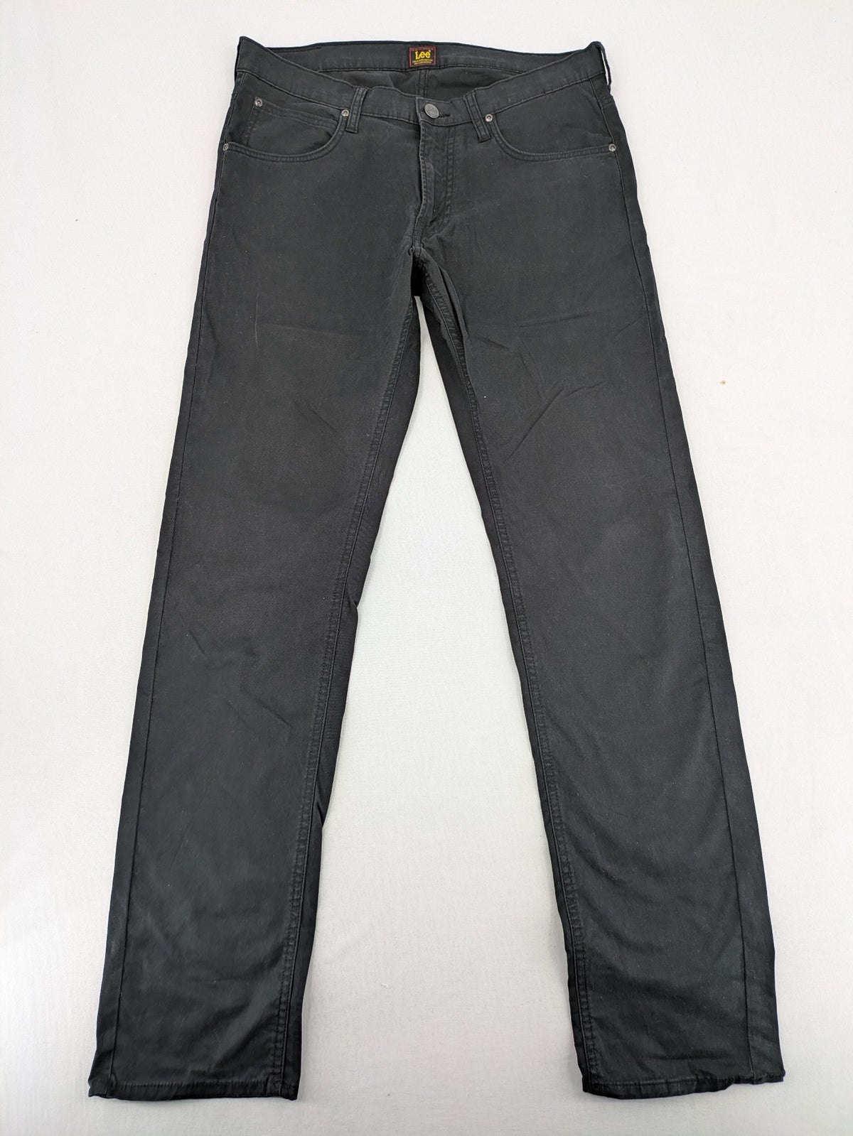 Lee straight jeans grey classic 5-pocket design with zip fly and subtle branding.