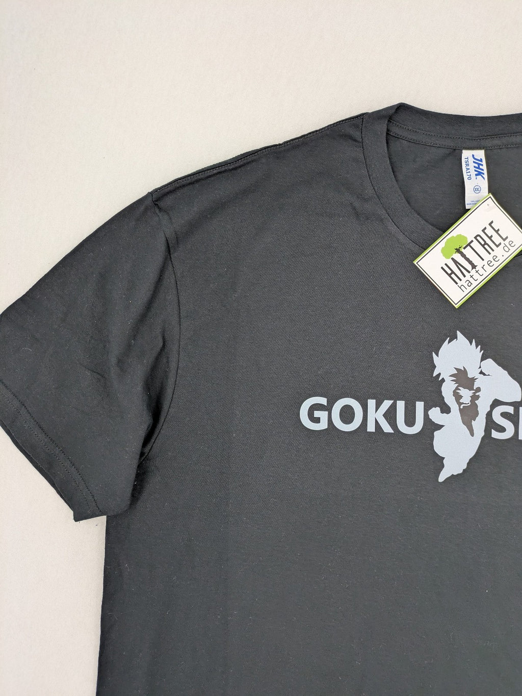 Dragon Ball Z blue graphic t-shirt featuring Goku Sport text and soft cotton material.