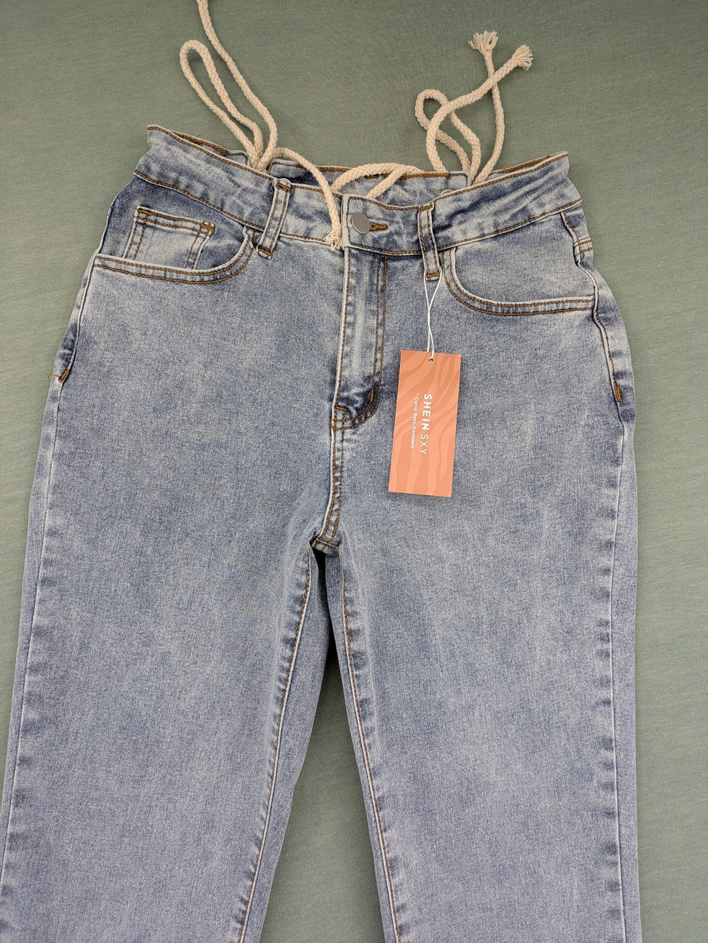 SHEIN blue straight jeans high waist with unique lacing details and stylish design.