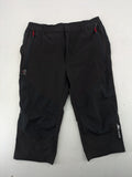 Outdoor black capri pants with elastic waistband and multiple zippered pockets.