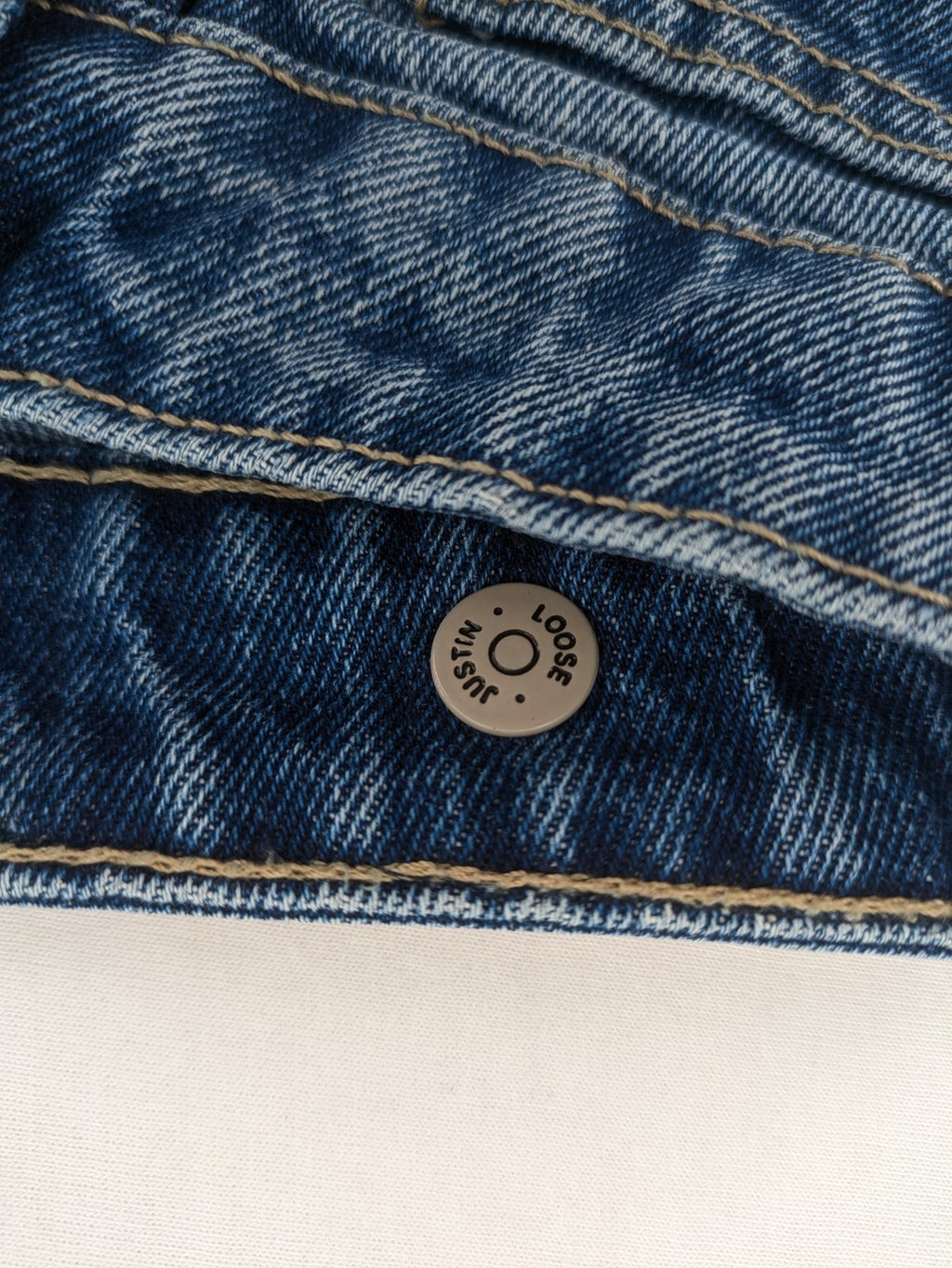 FSBN blue straight jeans with distressed knee rips and classic button fly.
